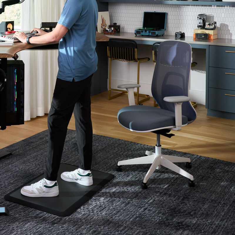vari ascent chair in steel blue in home office setting with professional sitting image number null